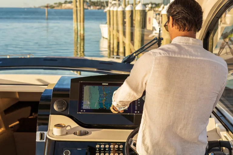 2026-Sundancer-370-Outboard-DAO370-lifestyle-man-helm-06642-X4